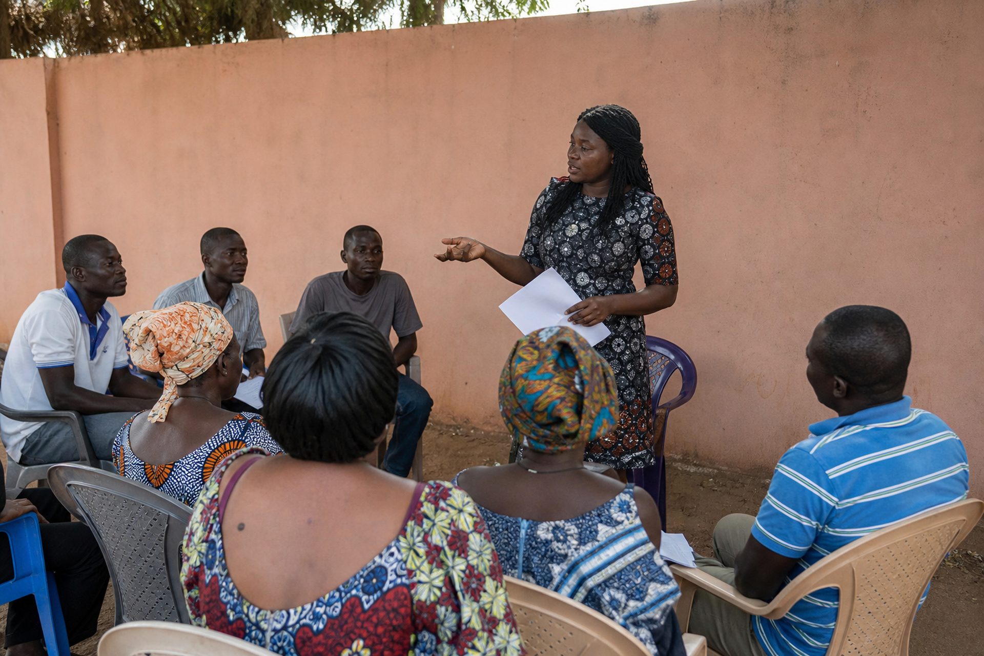 Community facilitator speaking on health rights in Greater Accra